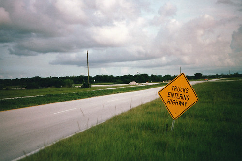 Freight truck on highway representing narrowing gap between contract and spot market rates